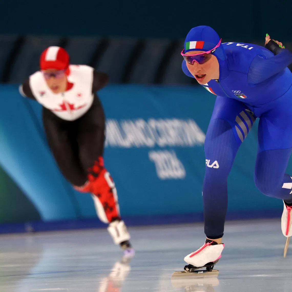 Milano Cortina 2026 Olympics - Speed Skating - Women's 3000m - Milano Speed Skating Stadium, Milan, Italy - February 07, 2026. Francesca Lollobrigida of Italy in action with Valerie Maltais of Canada during women's 3000m. REUTERS/Piroschka Van De Wouw