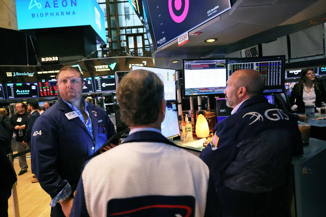 Traders work on the floor of the New York Stock Exchange, in New York City.