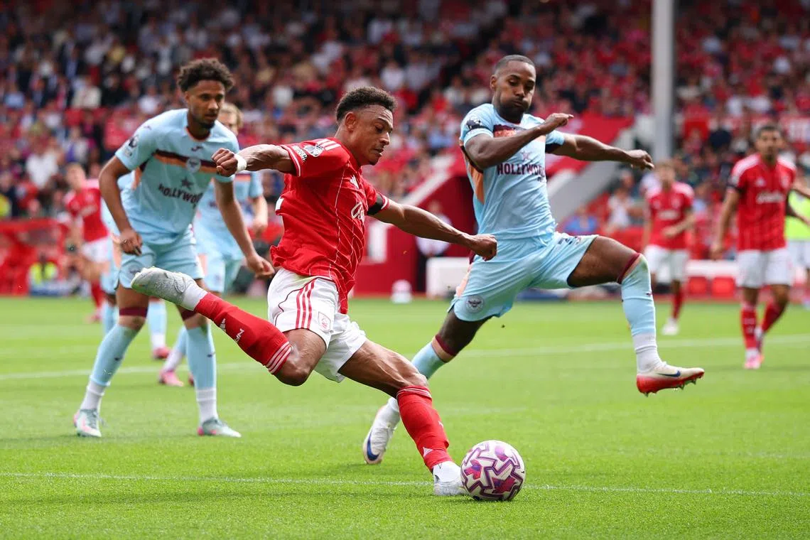 Soccer Football - Premier League - Nottingham Forest v Brentford - The City Ground, Nottingham, Britain - August 17, 2025 Nottingham Forest's Dan Ndoye in action with Brentford's Rico Henry Action Images via Reuters/Andrew Boyers