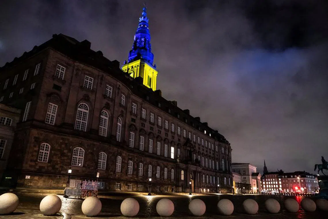 FILE PHOTO: Christiansborg Palace is lit in the colours of the Ukrainian flag to show support to Ukraine on the one-year anniversary of Russia's invasion, in Copenhagen, Denmark February 24, 2023.  Ritzau Scanpix/Mads Claus Rasmussen via REUTERS