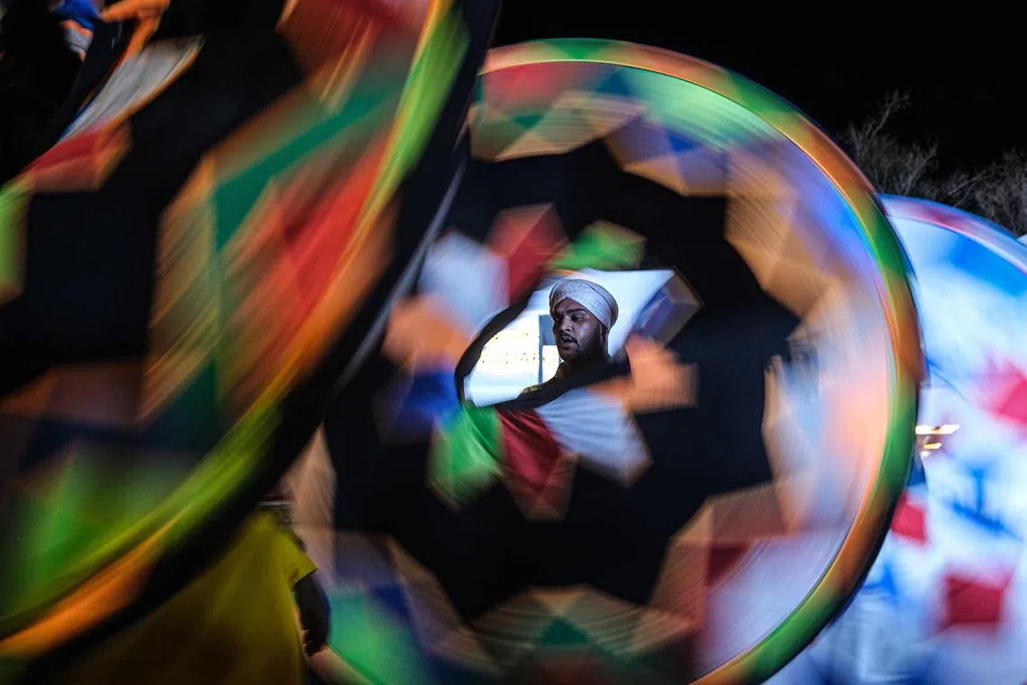 Egyptian tradional dancers perform the 'Tanoura' dance during a street performance in Sharm El-Sheikh, Egypt, Nov 6, 2022. 