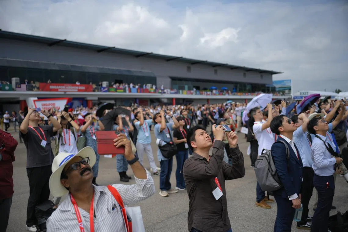 Spectators seen during the aerial display at the Singapore Airshow on Feb 21, 2024.