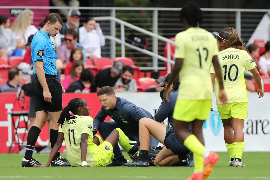 Sep 7, 2024; Washington, District of Columbia, USA; Washington Spirit forward Ouleymata Sarr (11) is helped after an apparent injury following a play against Portland Thorns FC at Audi Field. Mandatory Credit: Patrick Ruddy-Imagn Images/ File Photo
