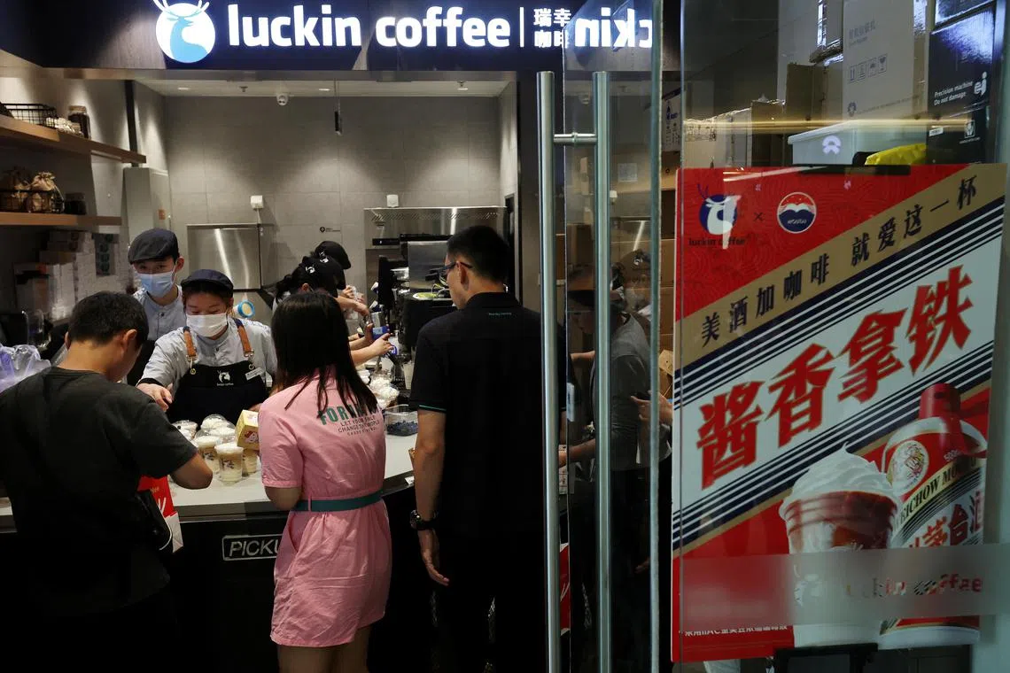 An advertisement promoting a Kweichow Moutai liquor latte is seen at a Luckin Coffee store in Beijing, China, on Sept 4, 2023. 