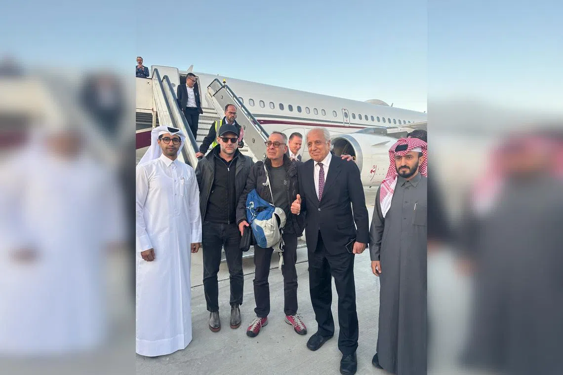 US citizen George Glezmann (centre) celebrating his release with US official Adam Boehler (centre left), former US envoy to Afghanistan Zalmay Khalilzad (centre right) and Qatari diplomats in Kabul on March 20.
