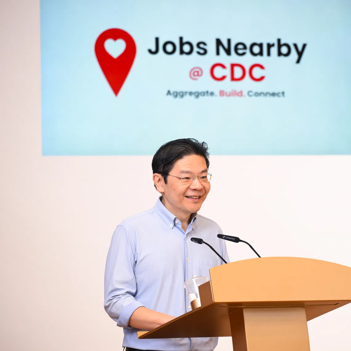 Prime Minister Lawrence Wong said that both national policies and community-level initiatives are needed to support the training and job needs of Singaporeans.