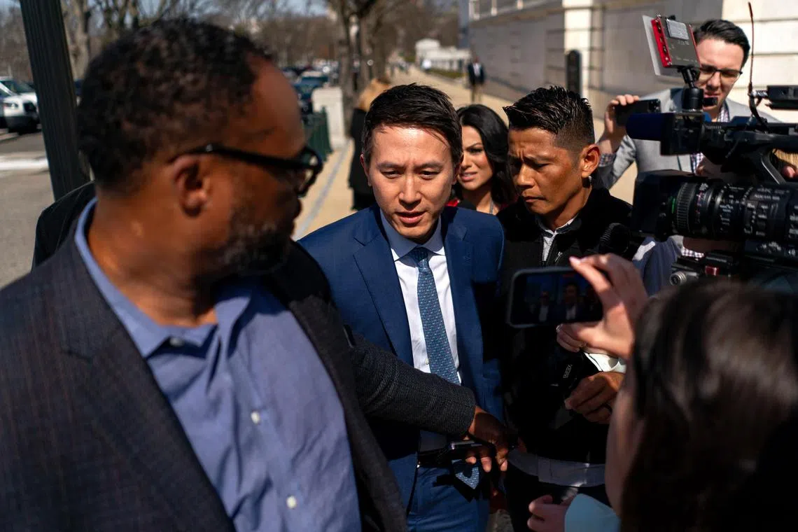 Shou Chew, chief executive of TikTok makes his way through reporters on Capitol Hill in Washington, March 14, 2024. Chew, posted a video on Wednesday addressing users, saying a ban of the service would hurt small businesses in the United States. (Kent Nishimura/The New York Times) 