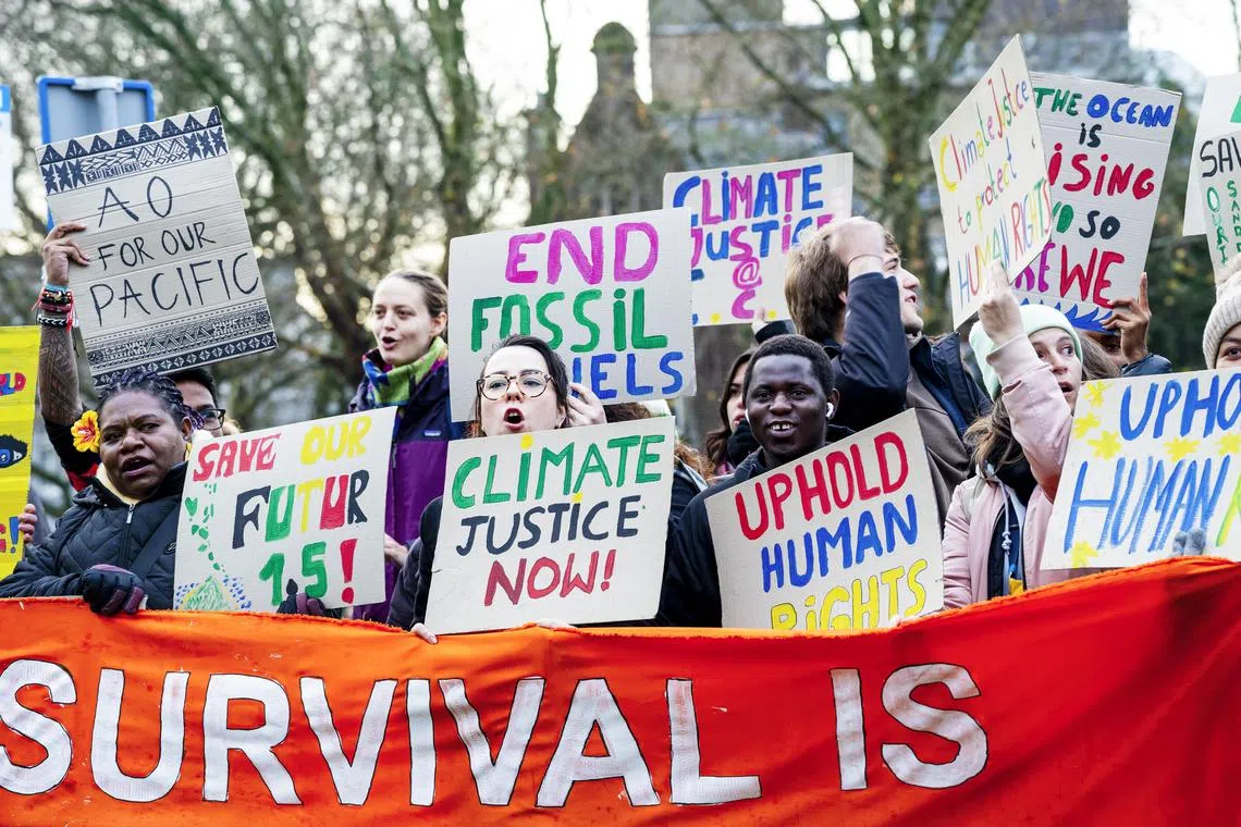 epa11752975 Climate activists demonstrate for climate justice in front of the International Court of Justice (ICJ) in The Hague, The Netherlands, 02 December 2024. The ICJ, from 02 to 13 December, will hold public hearings for the first time to determine what legal obligations countries have to protect the climate.  EPA-EFE/LINA SELG