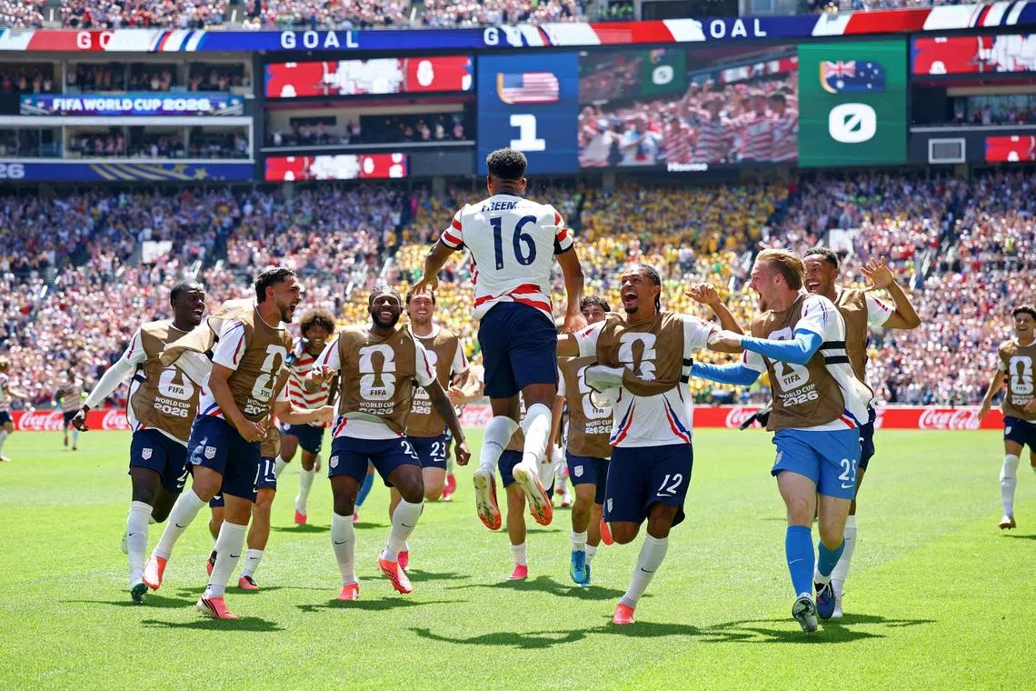 Soccer Football - FIFA World Cup 2026 - Group D - United States v Australia - Seattle Stadium, Seattle, Washington, U.S. - June 19, 2026 Alex Freeman of the U.S. celebrates scoring their second goal with teammates REUTERS/Albert Gea