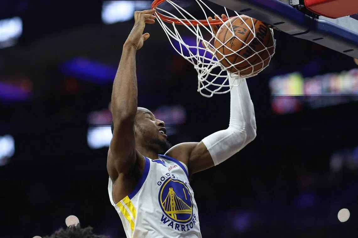 Golden State Warriors forward Jonathan Kuminga dunks the ball against the Philadelphia 76ers during the third quarter at Xfinity Mobile Arena. 