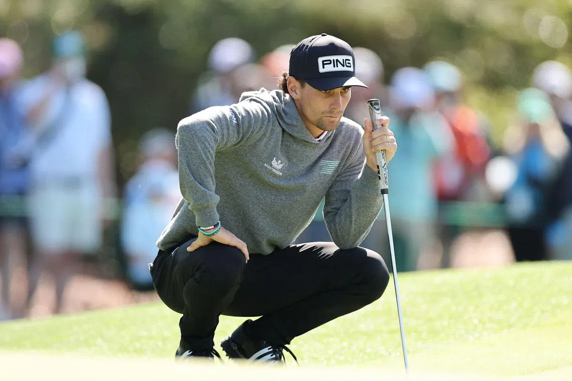 LIV Golf player Joaquin Niemann of Chile lining up a putt on the first green during a practice round ahead of the 2025 Masters Tournament at Augusta National Golf Club.