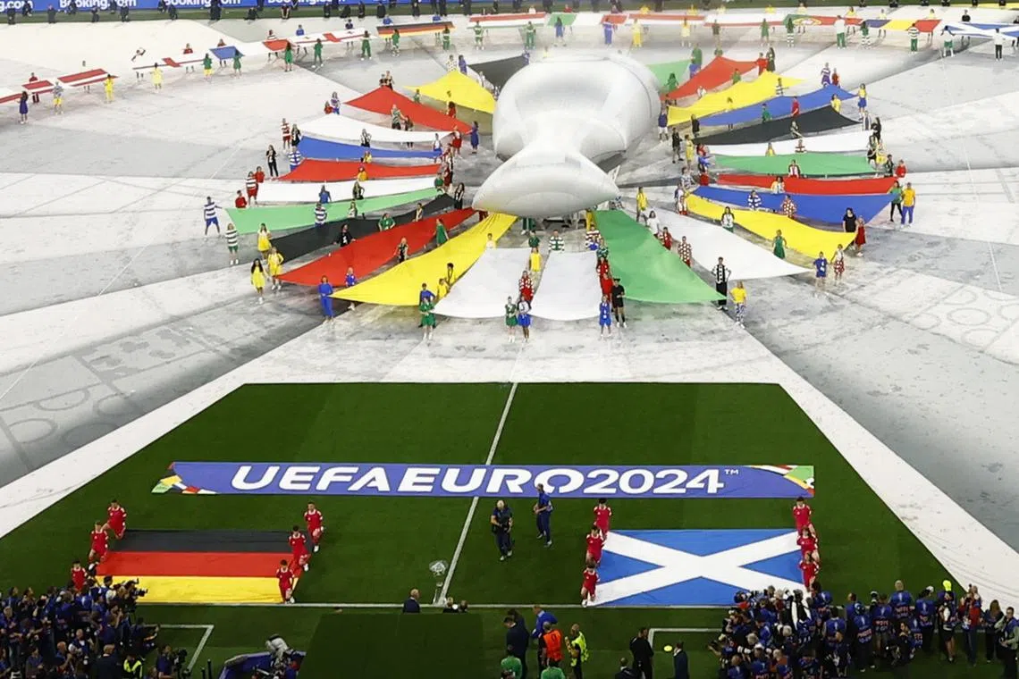 Soccer Football - Euro 2024 - Group A - Germany v Scotland - Munich Football Arena, Munich, Germany - June 14, 2024  A giant replica European Championship Trophy is displayed during the pre match show inside the stadium before the match REUTERS/Michaela Stache