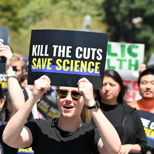 Demonstrators rally during a “Kill the Cuts” protest against the Trump administration’s funding cuts in April 2025.
