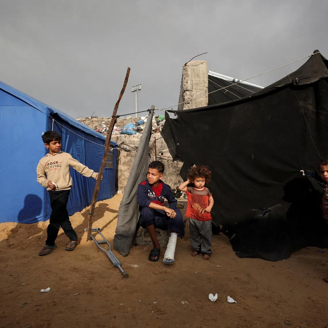 Displaced Palestinian children gather at a tent camp in Gaza City, February 3, 2026. REUTERS/Dawoud Abu Alkas/File Photo