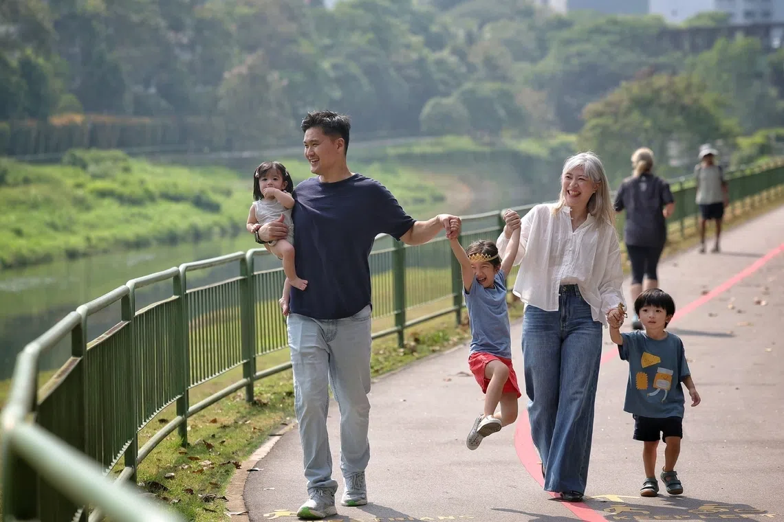 The Straits Times journalist Alyssa Woo (second from right), 36, with her husband Samuel Wong (second from left), 38, and children (from left) Lara, one, Liv, five, and Lucas, three.