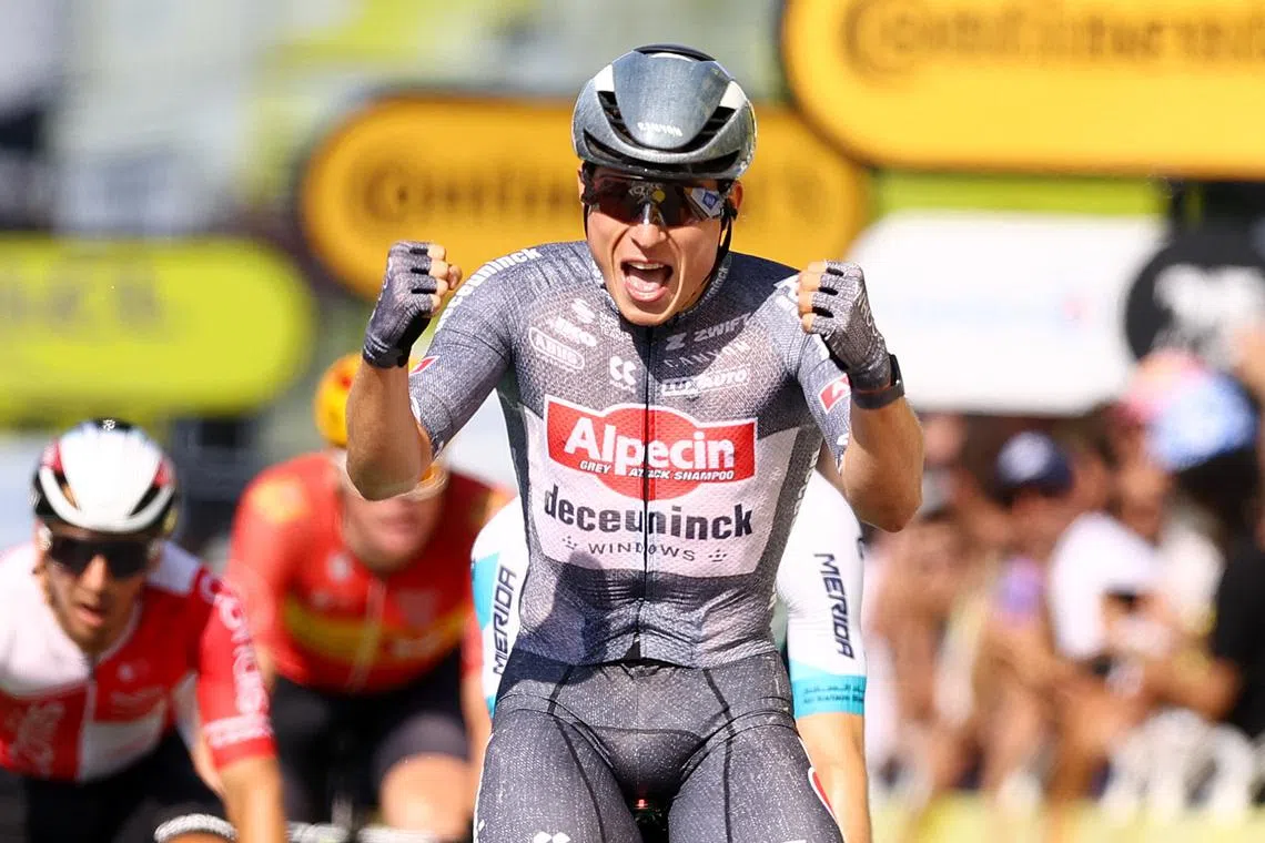 Cycling - Tour de France - Stage 16 - Gruissan to Nimes - Gruissan, France - July 16, 2024 Alpecin - Deceuninck's Jasper Philipsen celebrates winning stage 16 REUTERS/Molly Darlington