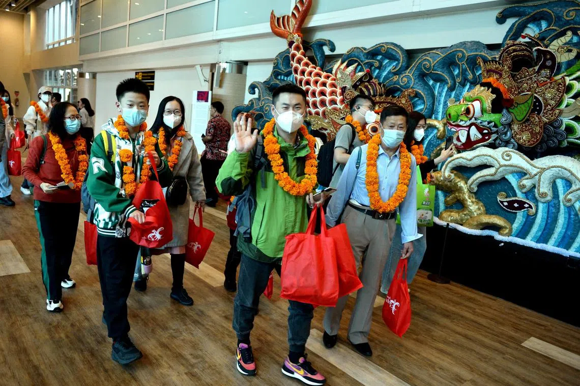FILE PHOTO: First batch of Chinese tourists arrived at Ngurah Rai InternationalÊAirport following the Chinese Government's resumption of travel for citizens in Bali, Indonesia, January 22, 2023 Antara Foto/Fikri Yusuf/via REUTERS ATTENTION EDITORS - THIS IMAGE HAS BEEN SUPPLIED BY A THIRD PARTY. MANDATORY CREDIT. INDONESIA OUT. NO COMMERCIAL OR EDITORIAL SALES IN INDONESIA./File Photo