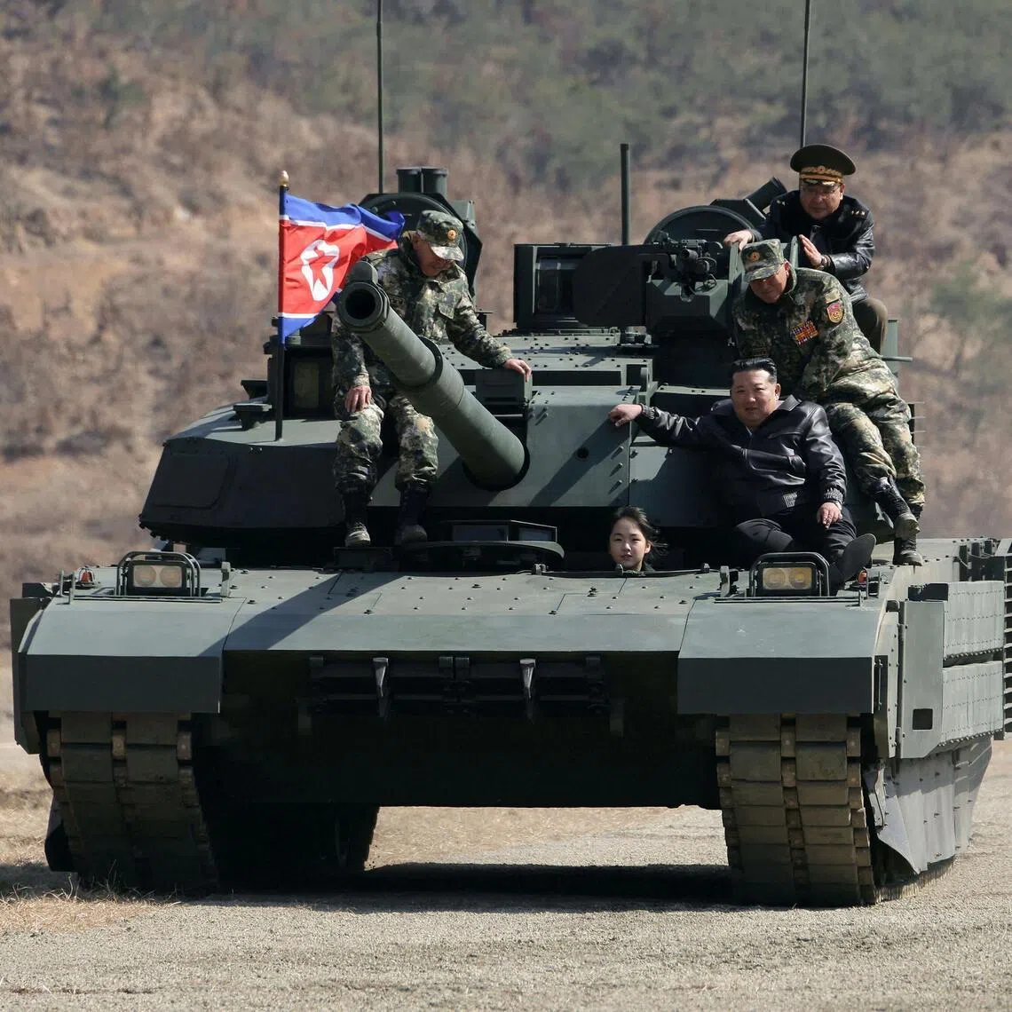 North Korean leader Kim Jong Un and his daughter, Ju Ae, take a ride on North Korea’s latest main battle tank.
