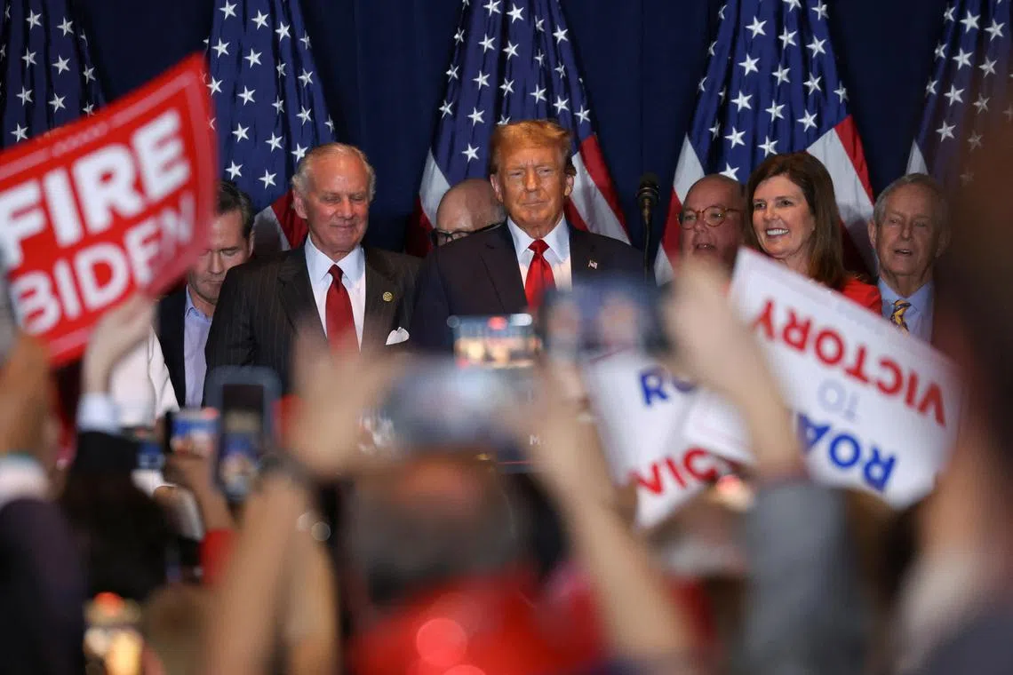 Republican presidential candidate and former US President Donald Trump stands on stage as he hosts a South Carolina Republican presidential primary election night party in Columbia, South Carolina on Feb 24, 2024. 