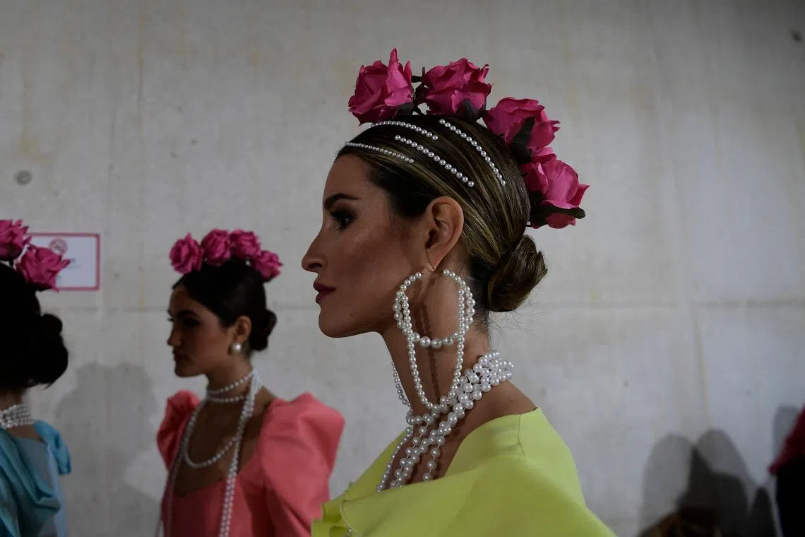 A model gets ready backstage before presenting creations during the Simof 2023 (International Flamenco Fashion Show) in Sevilla on Jan 28, 2023. 
