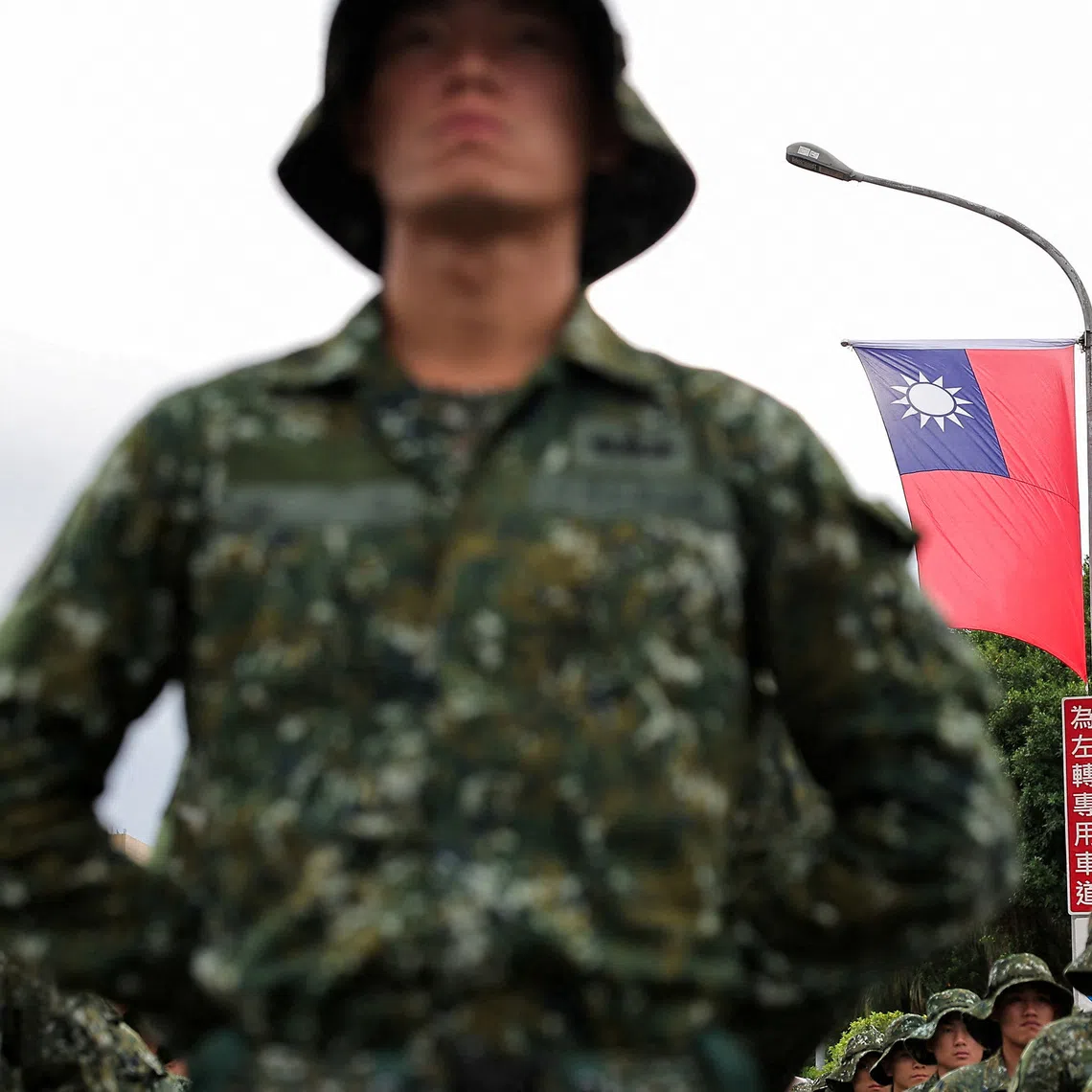 A Taiwan flag flutters in the wind as soldiers prepare to celebrate national day to mark the 113th birthday of the Republic of China, Taiwan's formal name, in Taipei, Taiwan October 10, 2024. REUTERS/Ann Wang