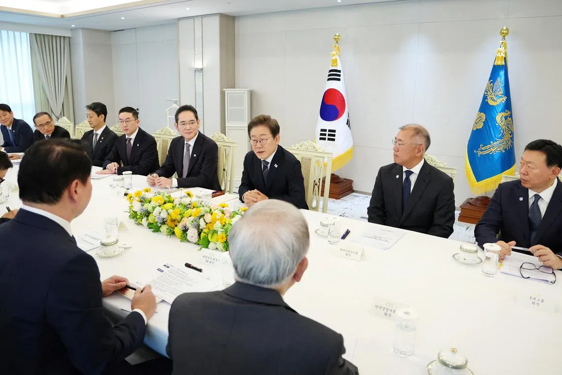 South Korean President Lee Jae-myung (third from right) during a meeting with business leaders at the Presidential Office in Seoul, South Korea, on June 13.