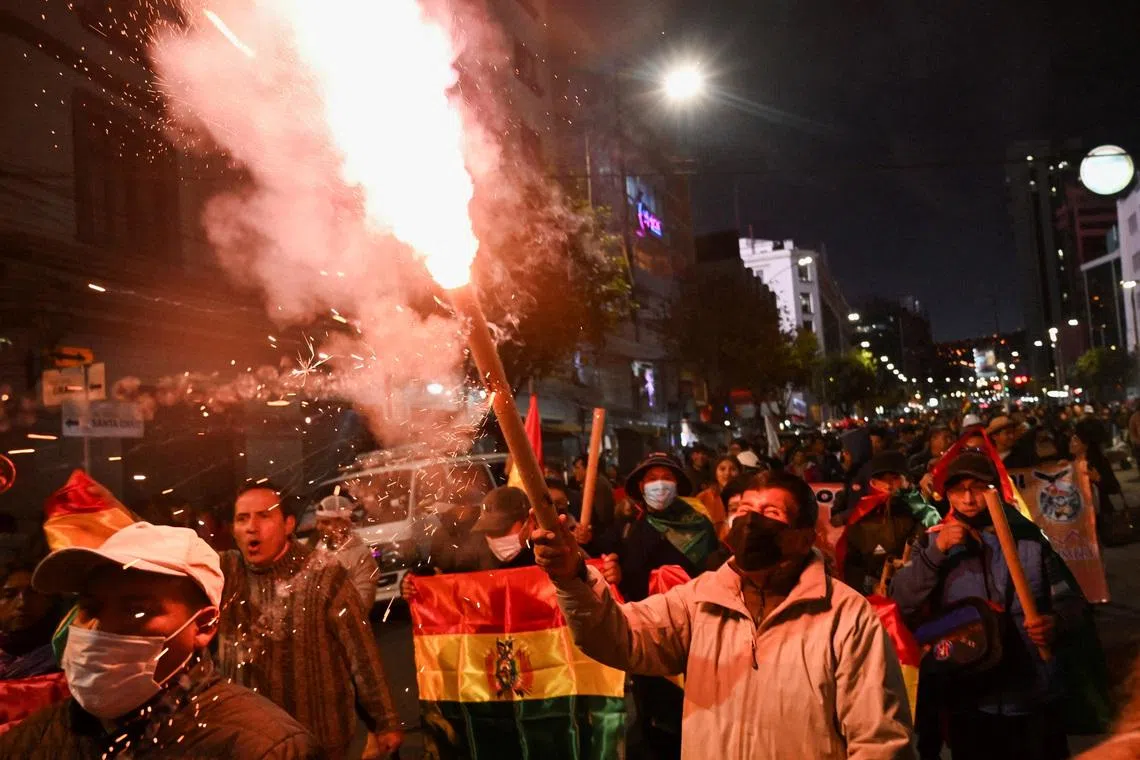 Demonstrators take part in a march, which organizers have dubbed a \"defense of democracy,\" to rally against road blockades and what they call pressure measures used by protesters calling for the resignation of Bolivia’s President Rodrigo Paz, amid the country’s economic and fuel crisis, in La Paz, Bolivia, May 20, 2026. REUTERS/Claudia Morales