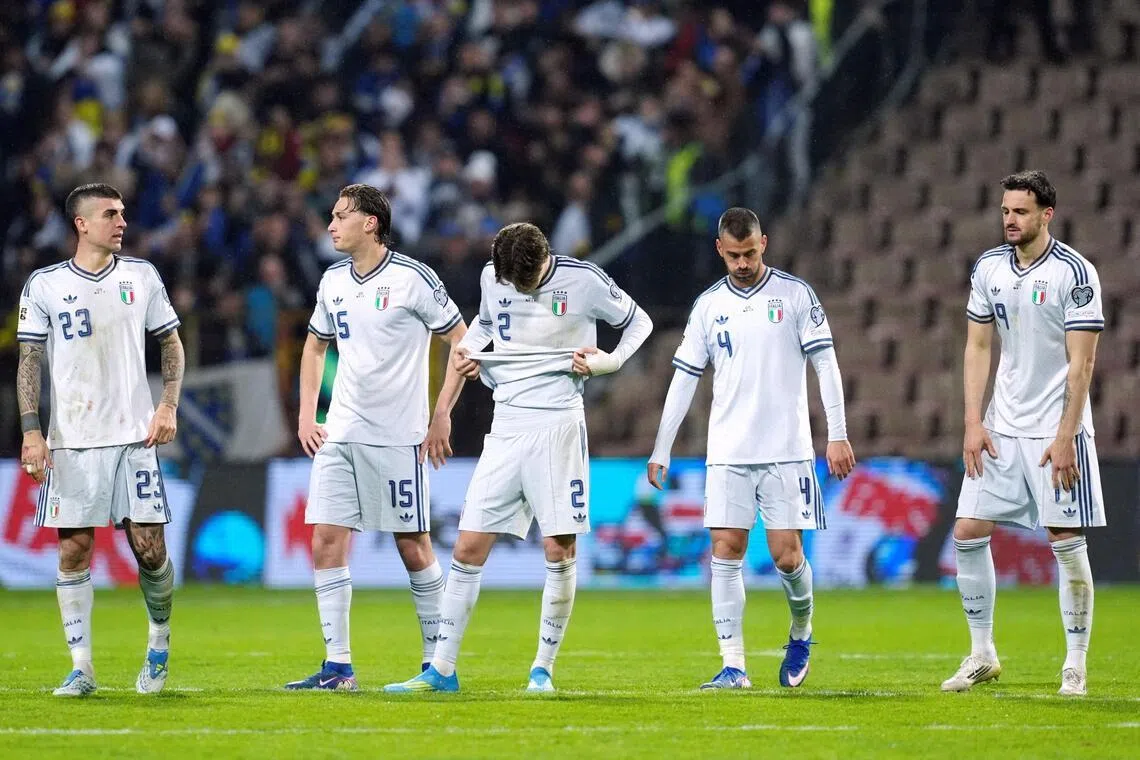 Italy's Gianluca Mancini, Pio Esposito, Marco Palestra, Leonardo Spinazzola and Federico Gatti looking dejected after failing to qualify for the 2026 World Cup following a penalty shoot-out defeat by Bosnia and Herzegovina at the Bilino Polje Stadium in Zenica, Bosnia, on March 31, 2026.