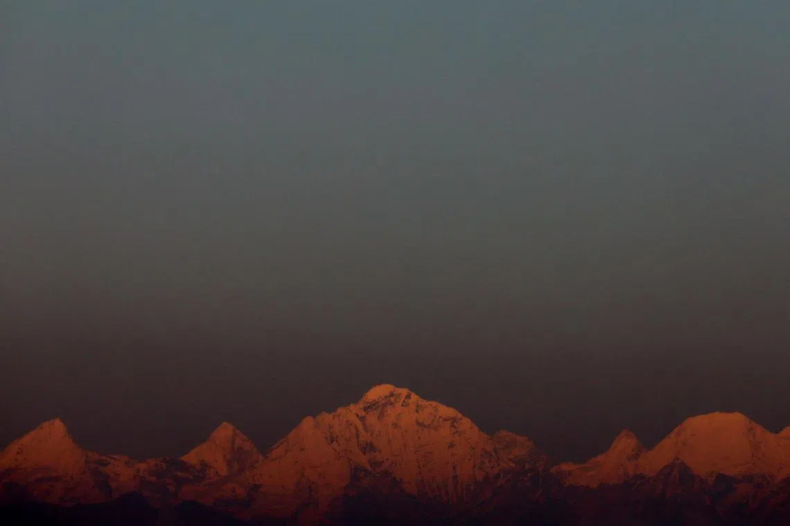 FILE PHOTO: Mount Everest, the world's highest mountain, and other peaks of the Himalayan range are seen during sunset from Kathmandu, Nepal October 17, 2022. REUTERS/Navesh Chitrakar/File Photo