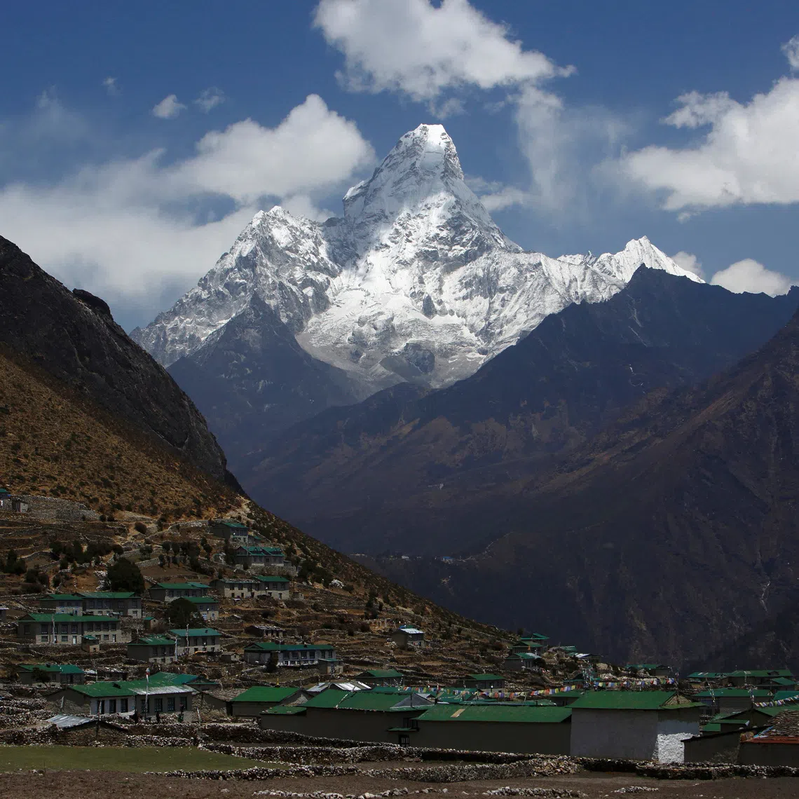Mount Ama Dablam, which stands approximately 6800 meters above sea level, is seen behind Khumjung Village in Solukhumbu District April 30, 2014.  REUTERS/Navesh Chitrakar