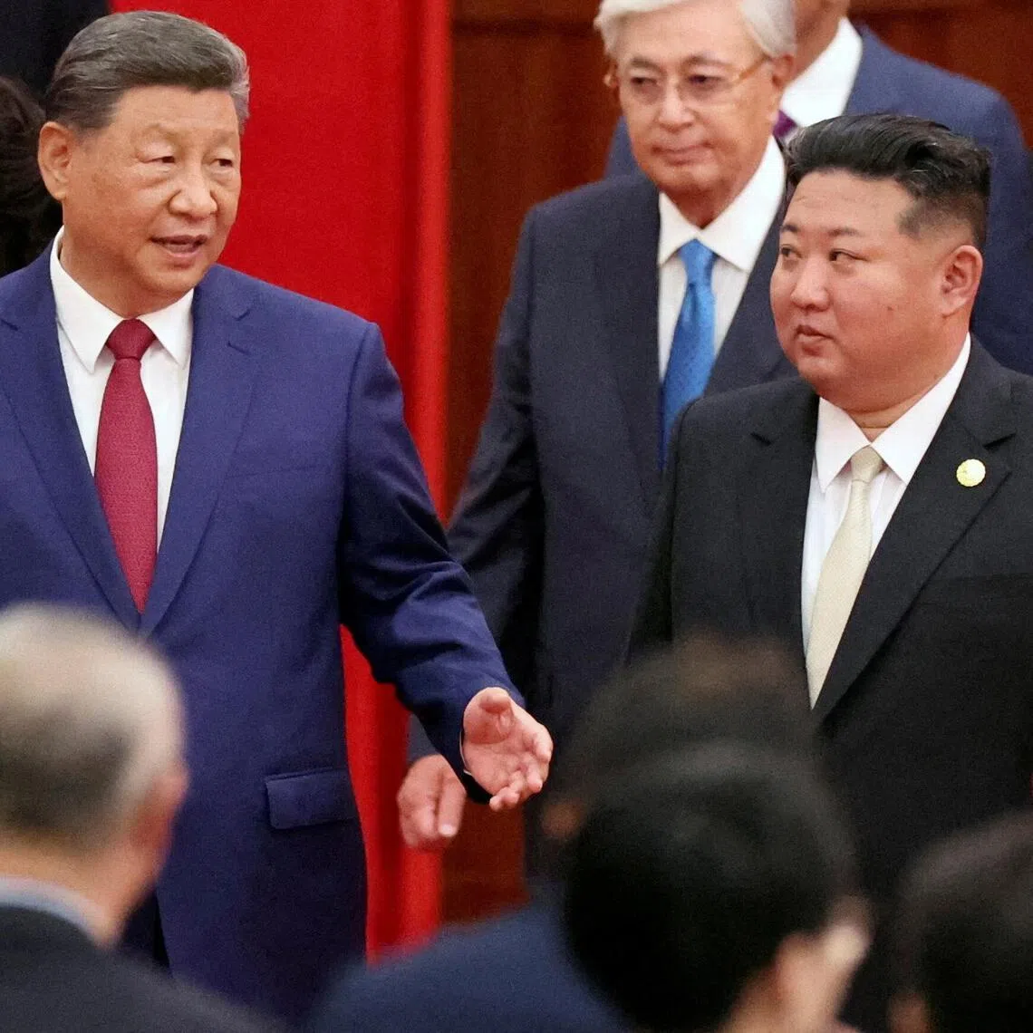 Chinese President Xi Jinping and North Korean leader Kim Jong Un arrive for a reception in Beijing on Sept 3, 2025.