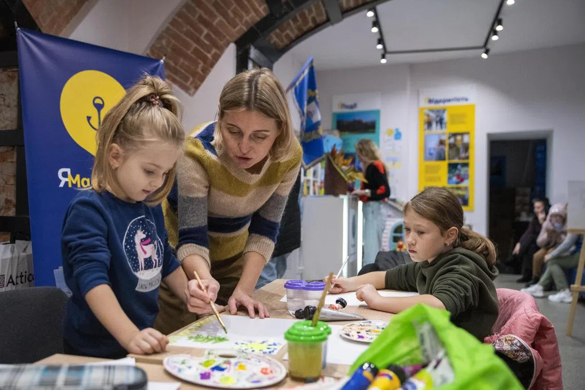 Nataliia Pavliuk teaches an art class at a support centre in Lviv that serves people displaced from eastern Ukraine. 