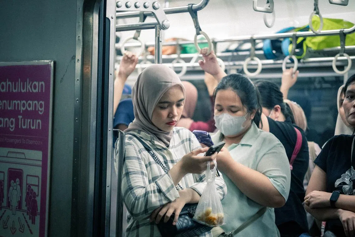 ‘I feel so stupid’: How young Indonesians get stuck on the debt treadmill