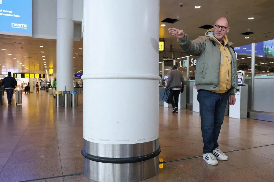 Belgian Walter Benjamin, who lost a leg in the March 22, 2016 suicide bomb attack at Brussels Airport, talks to Reuters while standing where he was during the blast as the Belgium prepares to mark the 10th anniversary of the attack, at Brussels Airport in Zaventem, Belgium, March 10, 2026. REUTERS/Yves Herman