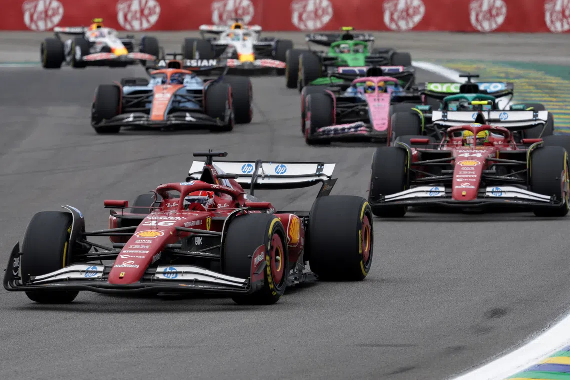 Formula One F1 - Sao Paulo Grand Prix - Autodromo Jose Carlos Pace, Sao Paulo, Brazil - November 8, 2025 Ferrari's Charles Leclerc and Ferrari's Lewis Hamilton in action during the sprint race REUTERS/Ricardo Moraes