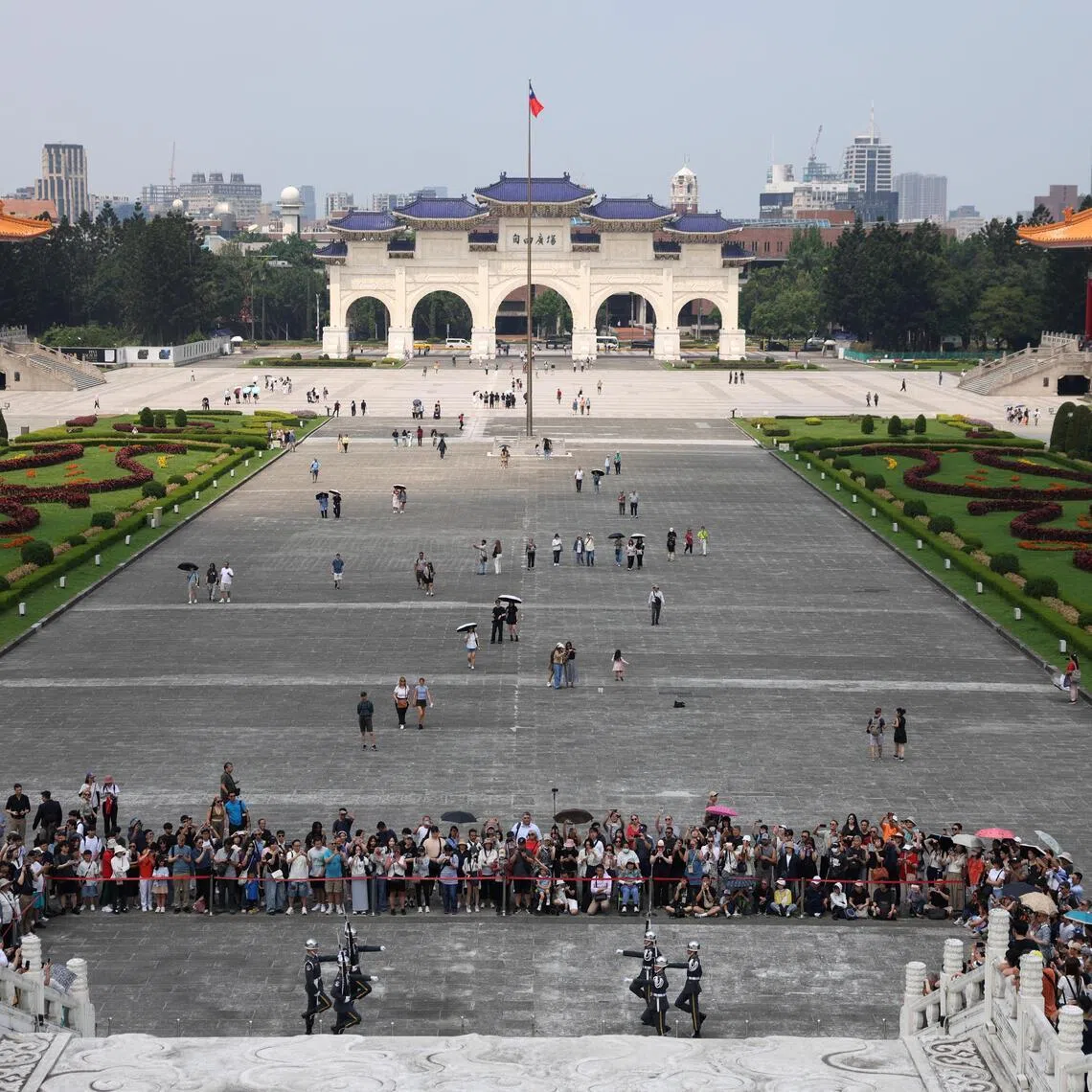 People watching a changing of the guard ceremony at the Chiang Kai-shek Memorial Hall in Taipei. 