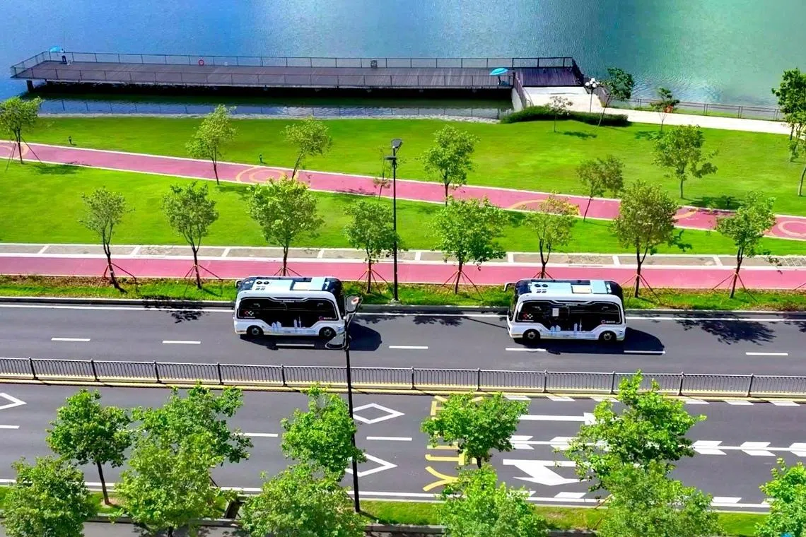 MOGOX buses serving an autonomous driving route between Hengqin island in Zhuhai, in China's Guangdong province, and Macau in 2026.