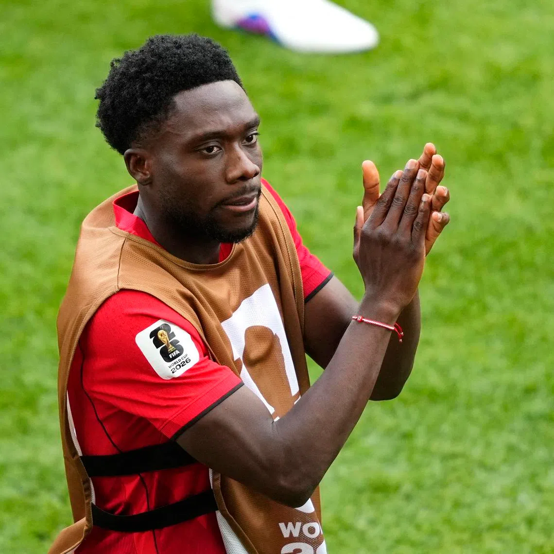 Soccer Football - FIFA World Cup 2026 - Group B - Canada v Bosnia and Herzegovina - Toronto Stadium, Toronto, Canada - June 12, 2026 Canada's Alphonso Davies applauds fans after the match IMAGN IMAGES via Reuters/Kevin Sousa