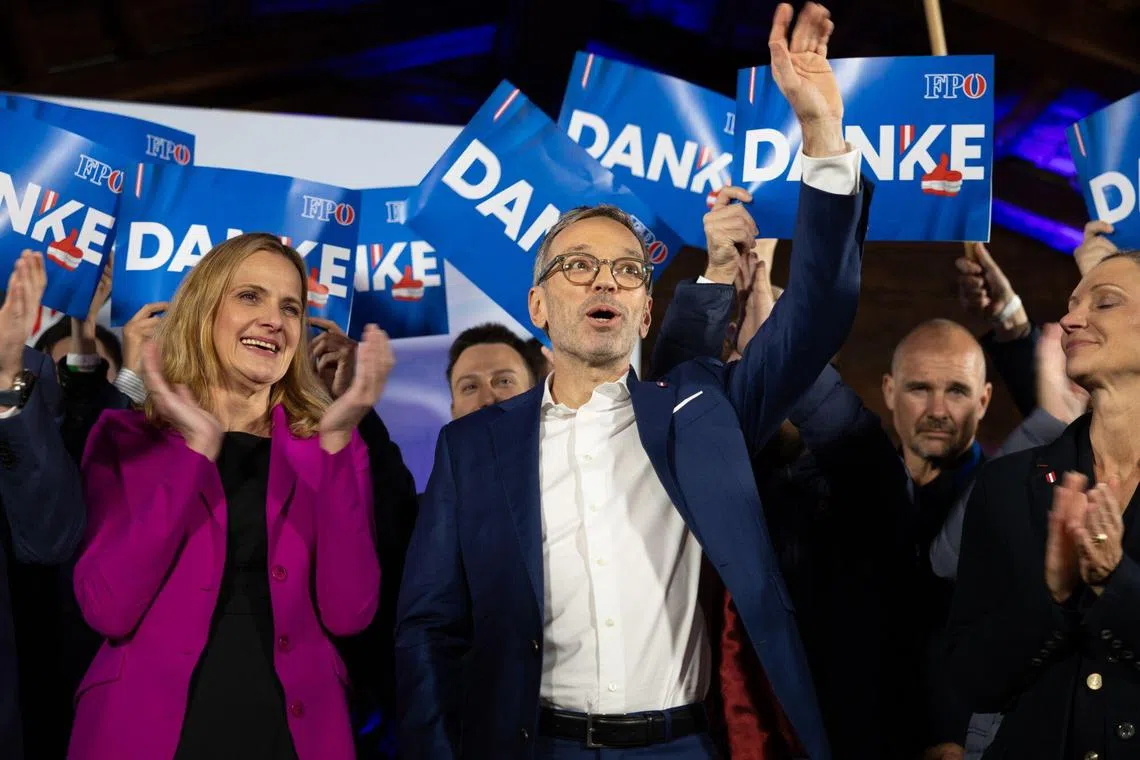 Herbert Kickl, leader of the Freedom Party of Austria (centre) celebrating with supporters during an election night rally in Vienna on Sept 29. 