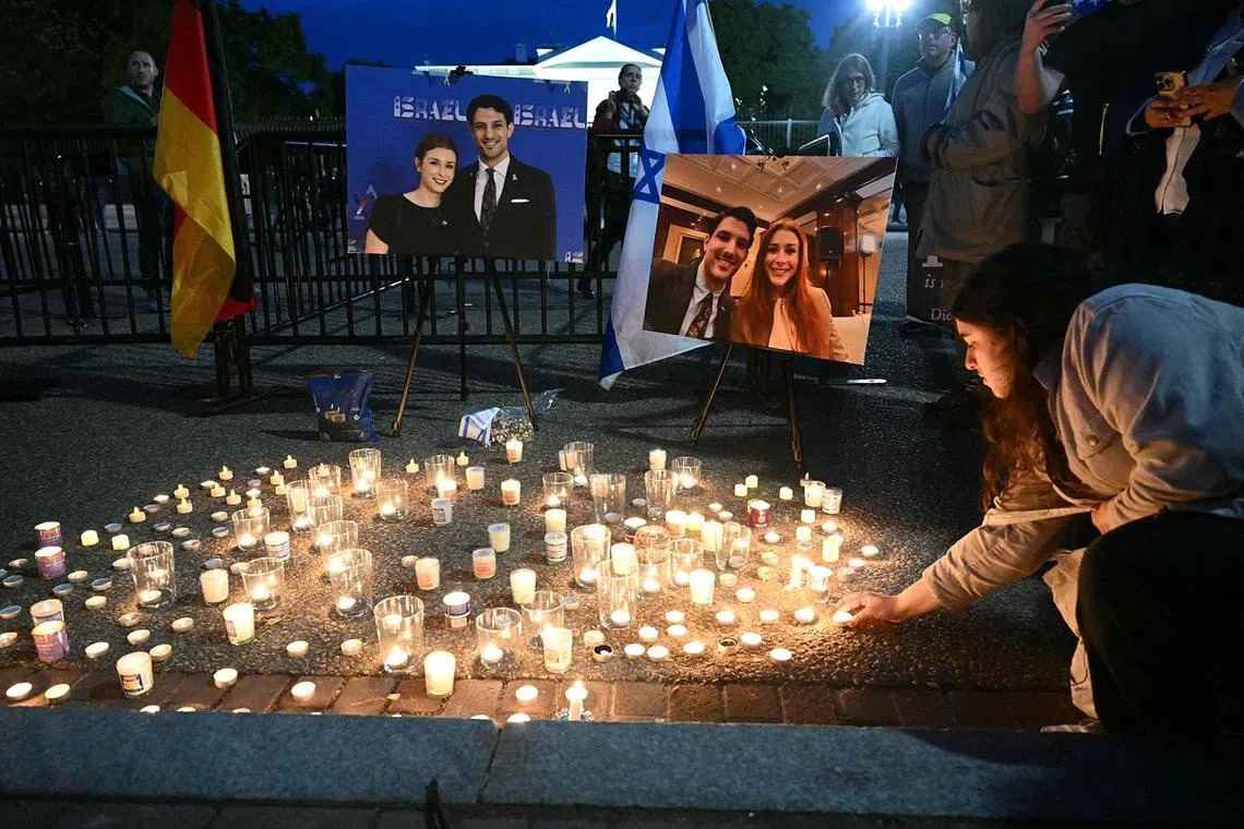 People attending a candlelight vigil at Lafayette Square across from the White House in Washington, DC on May 22, 2025, following a shooting that left two people dead. Elias Rodriguez faces murder and other charges after allegedly gunning down two Israeli embassy staffers outside the Capital Jewish Museum in Washington. 