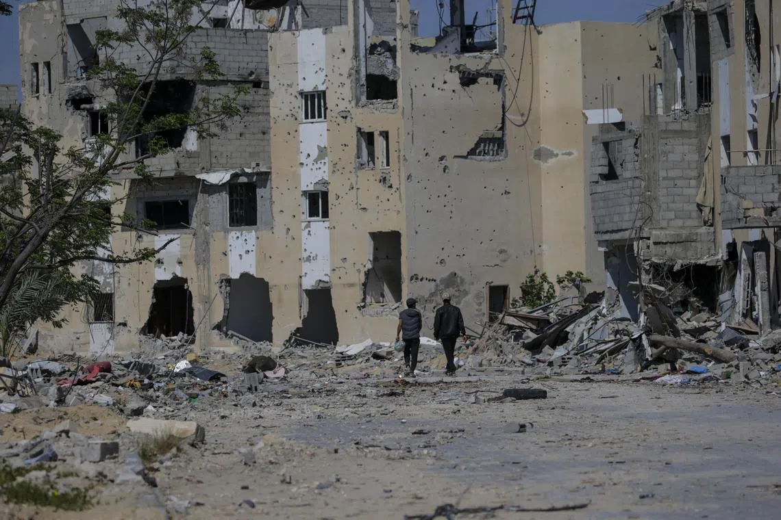 The rubble of destroyed houses as Palestinians return to Khan Younis after the Israeli military pulled out troops from the southern Gaza Strip, on April 9.
