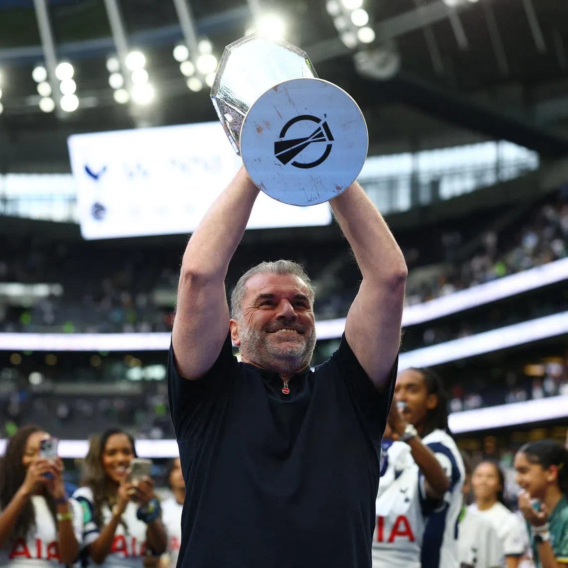 Ange Postecoglou holds the Europa League trophy during a lap of appreciation after the match. Tottenham Hotspur Stadium, London, Britain - May 25, 2025.  Action Images via Reuters/Matthew Childs/File Photo