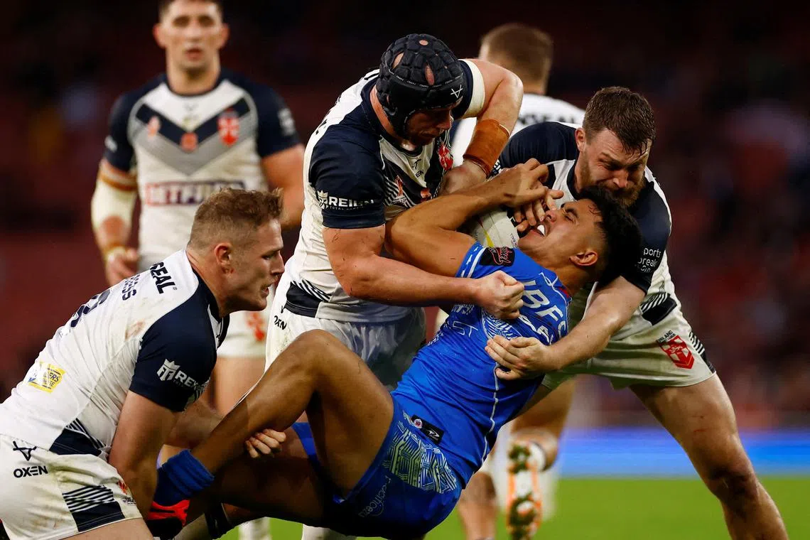 FILE PHOTO: Rugby League - World Cup - Semi Final - England v Samoa - Emirates Stadium, London, Britain - November 12, 2022 England's Chris Hill and Elliott Whitehead in action with Samoa's Joseph Sua'ali'i Action Images via Reuters/Andrew Boyers/File Photo
