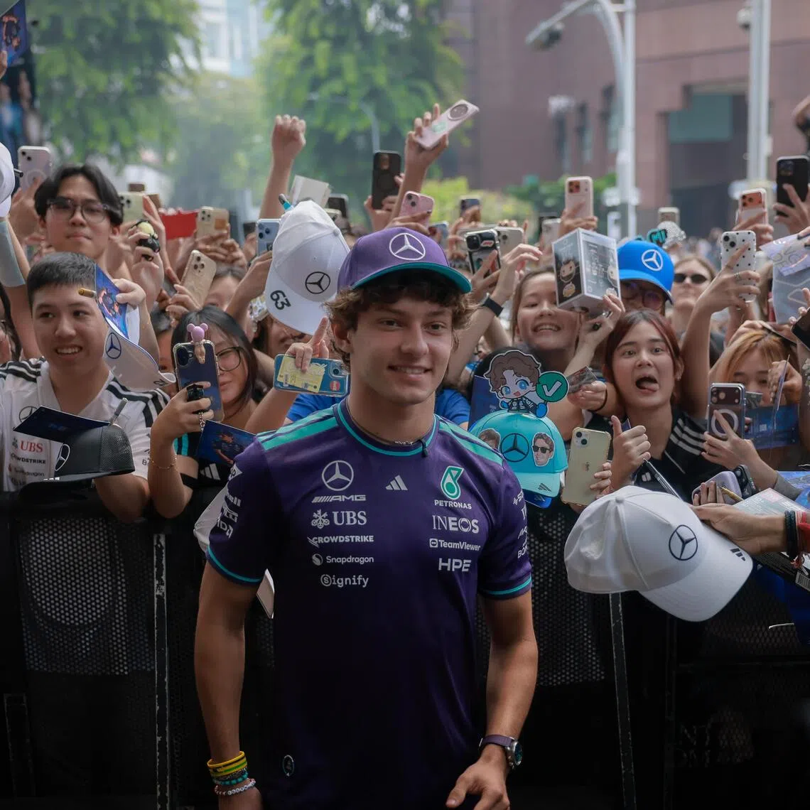 Mercedes Formula One driver Kimi Antonelli poses for photographs and signs autographs for fans at the Adidas Brand Centre Orchard on Oct 8.