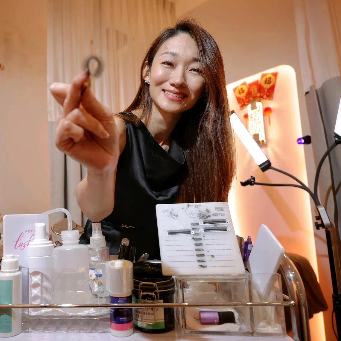 Portrait of Ms Jasmin Tay, founder of Perky Lash, at the outlet in Tampines 1 on Feb 3, 2025.