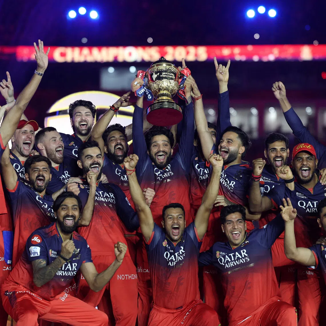 Cricket - Indian Premier League - IPL - Final - Royal Challengers Bengaluru v Punjab Kings - Narendra Modi Stadium, Ahmedabad, India - June 4, 2025 Royal Challengers Bengaluru's Rajat Patidar lifts the trophy as he celebrates with teammates after winning the Indian Premier League REUTERS/Amit Dave