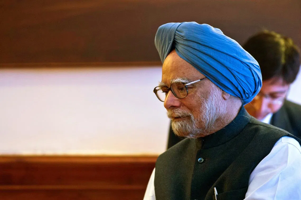 FILE PHOTO: India's Prime Minister Manmohan Singh talks to Lesotho's Prime Minister Tom Thabane (not pictured) during a meeting in New Delhi March 11, 2014.  REUTERS/Prakash Singh/Pool/File Photo