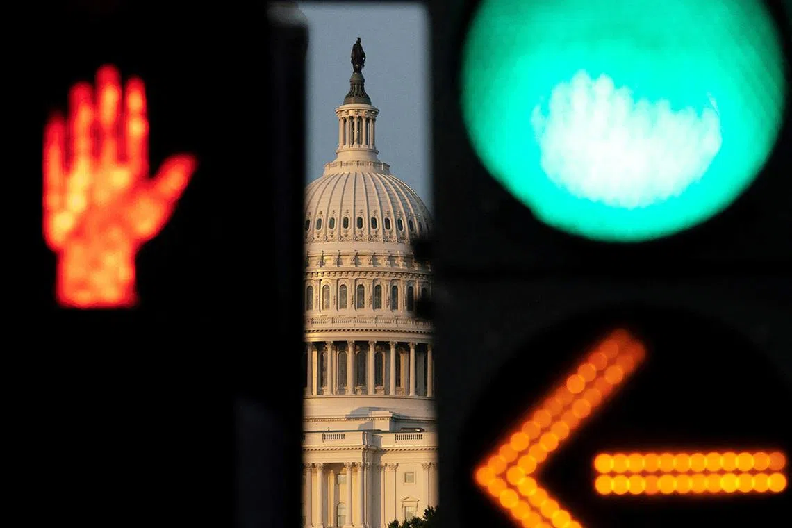 Stoplights change in front of the U.S. Capitol as Republican lawmakers struggle to pass U.S. President Donald Trump's sweeping spending and tax bill, on Capitol Hill in Washington, D.C., U.S., June 30, 2025. REUTERS/Nathan Howard TPX IMAGES OF THE DAY