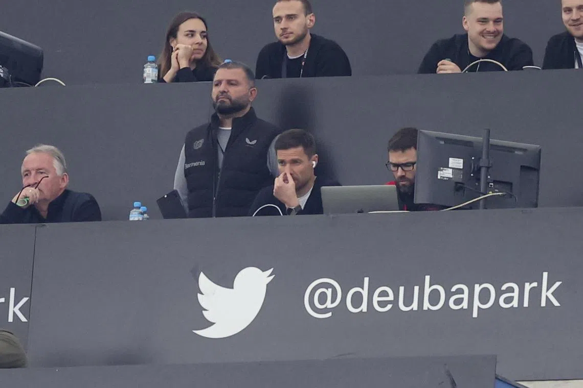 Bayer Leverkusen coach Xabi Alonso watching his side's Bundesliga  clash with Eintracht Frankfurt from the press area due to a suspension.