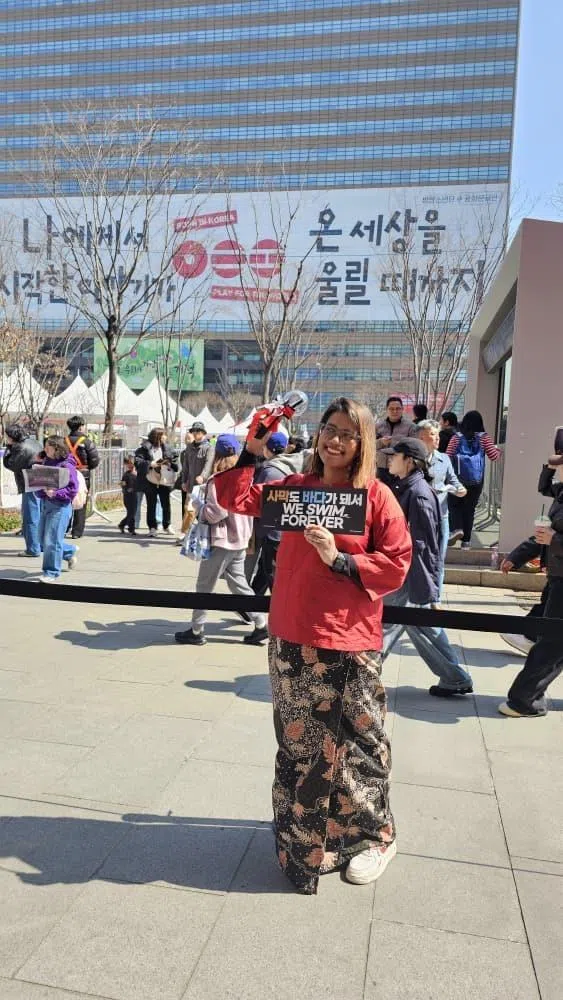 Singaporean permanent resident Rowena Hanafiah in front of the Kyobo Life Insurance Building, near Gwanghwamun Square, in Seoul before the concert.